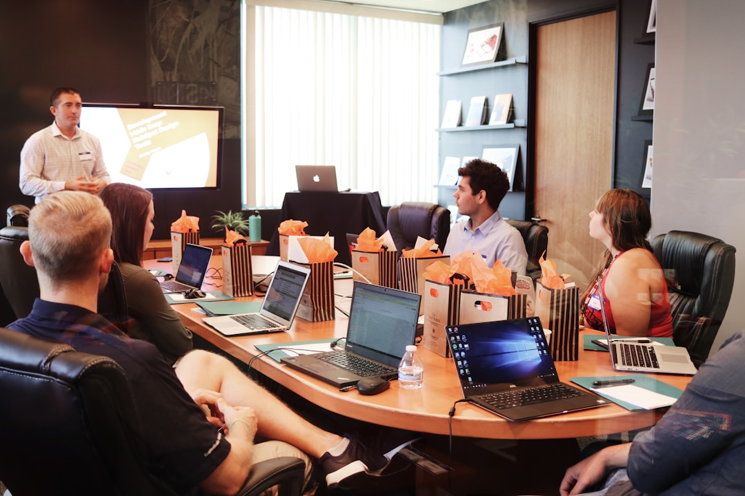 Employees working on understanding telecom expense management software and its relevance to small businesses